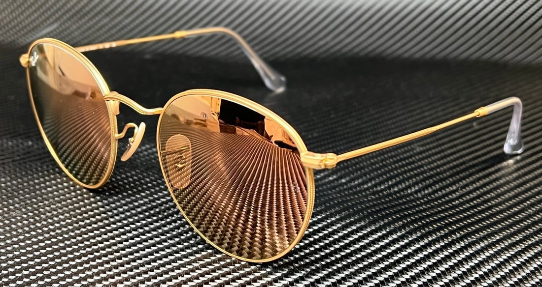 Ray-Ban RB3447 112 Z2 Gold Round Sunglasses with Case: Ray-Ban RB3447 112 Z2 Gold Round Sunglasses with Case Elevate your style with these RAY BAN RB3447 112 Z2 Gold Round Sunglasses, designed for the modern man. Featuring a classic round frame in a stunn