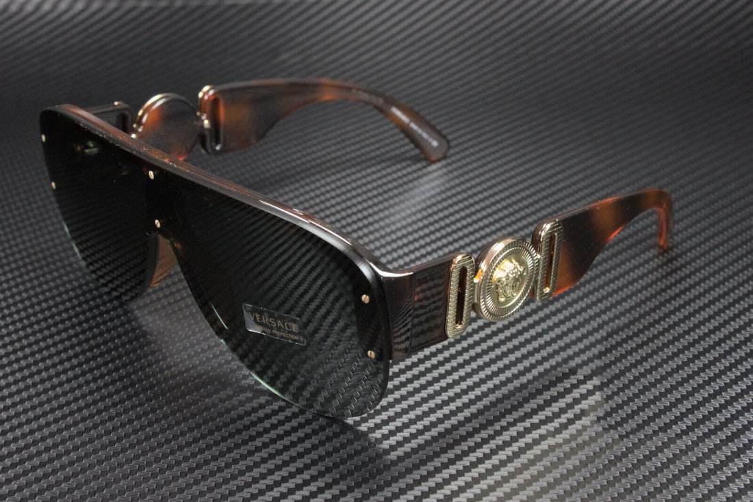 Versace VE4391 Havana Aviator Sunglasses Green Lenses 48mm: Versace VE4391 Havana Aviator Sunglasses Green Lenses 48mm Experience timeless elegance with these Versace VE4391 Havana Aviator Men's Sunglasses. Crafted with a sophisticated brown acetate frame, the