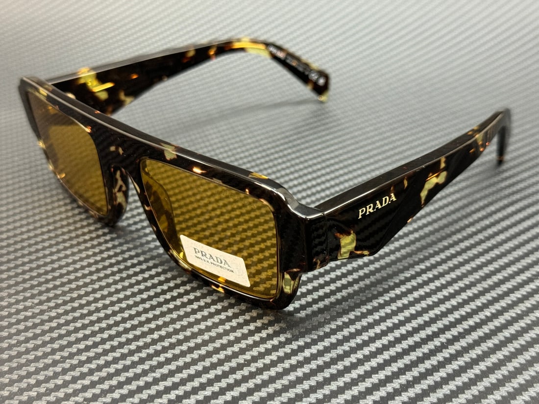 PRADA PR A05S 16O10C Black Tortoise Yellow Sunglasses with Authenticity: PRADA PR A05S 16O10C Black Tortoise Yellow Sunglasses with Authenticity Elevate your eyewear collection with these PRADA PR A05S 16O10C sunglasses. Featuring a striking black tortoise frame complement