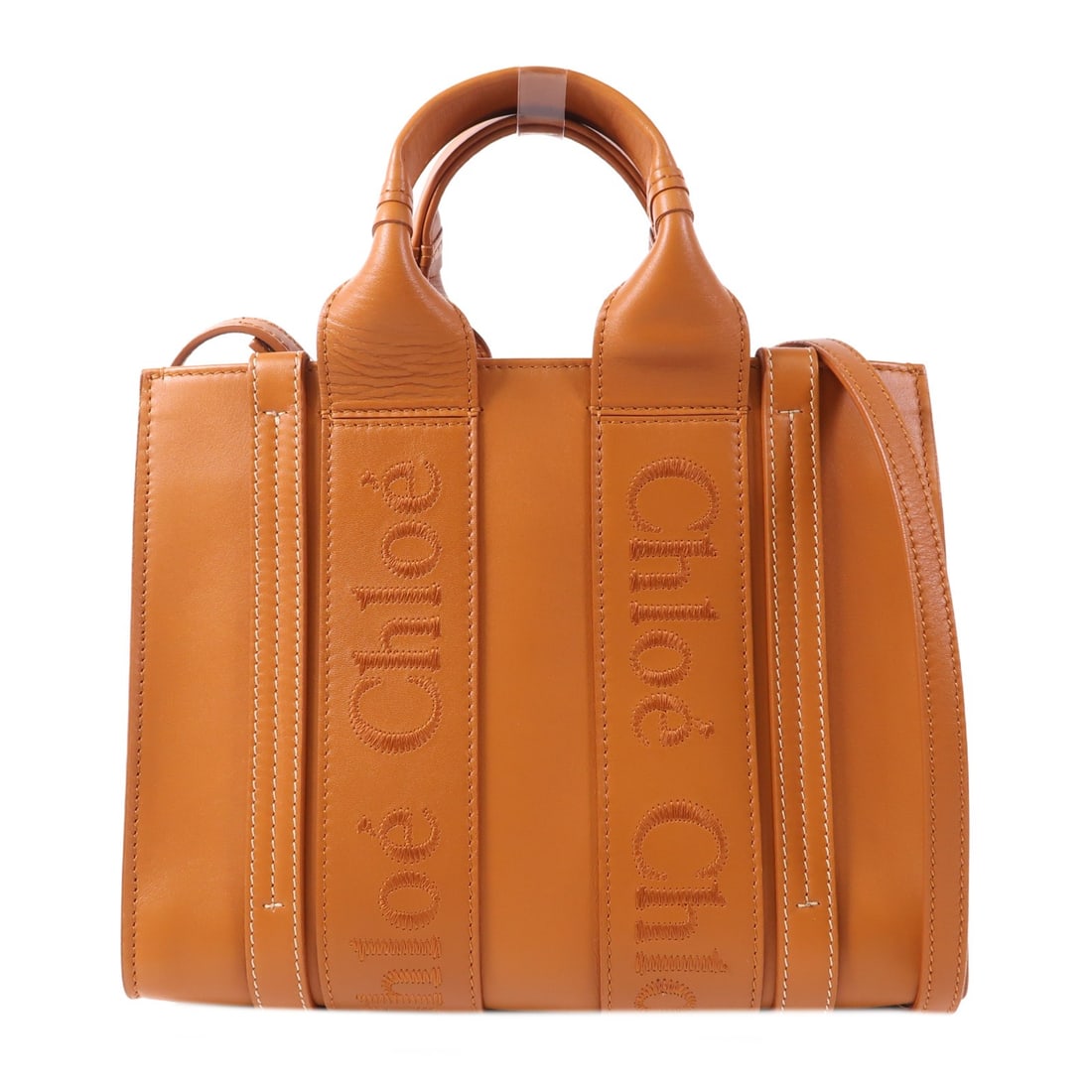 Chloe Small Woody 2 Way Shoulder Bag Calfskin Leather Brown: Chloe Small Woody 2 Way Shoulder Bag Calfskin Leather Brown Introducing the Chloe GHW Small Woody Bag, a versatile 2-way shoulder handbag crafted from high-quality calfskin leather in a rich brown hue