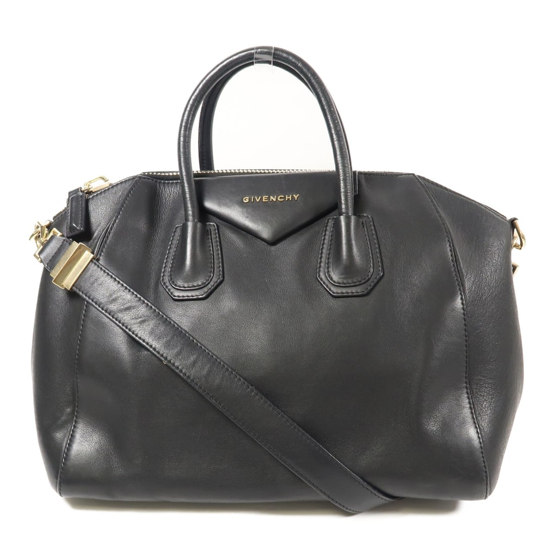 GIVENCHY Black Calfskin 2 Way Shoulder Bag with GHW: GIVENCHY Black Calfskin 2 Way Shoulder Bag with GHW This GIVENCHY 2 Way Shoulder Bag is crafted from luxurious black calfskin leather, offering a sophisticated accessory for any occasion. The bag feat