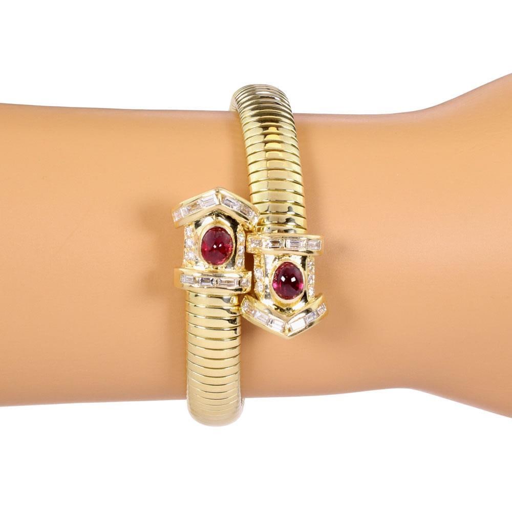 18k Yellow Gold Snake Flex Cuff Bracelet with Diamonds and Rubies: 18k Yellow Gold Snake Flex Cuff Bracelet with Diamonds and Rubies This exquisite flex cuff bracelet features a striking snake design, expertly crafted from 18k yellow gold with a polished finish. The
