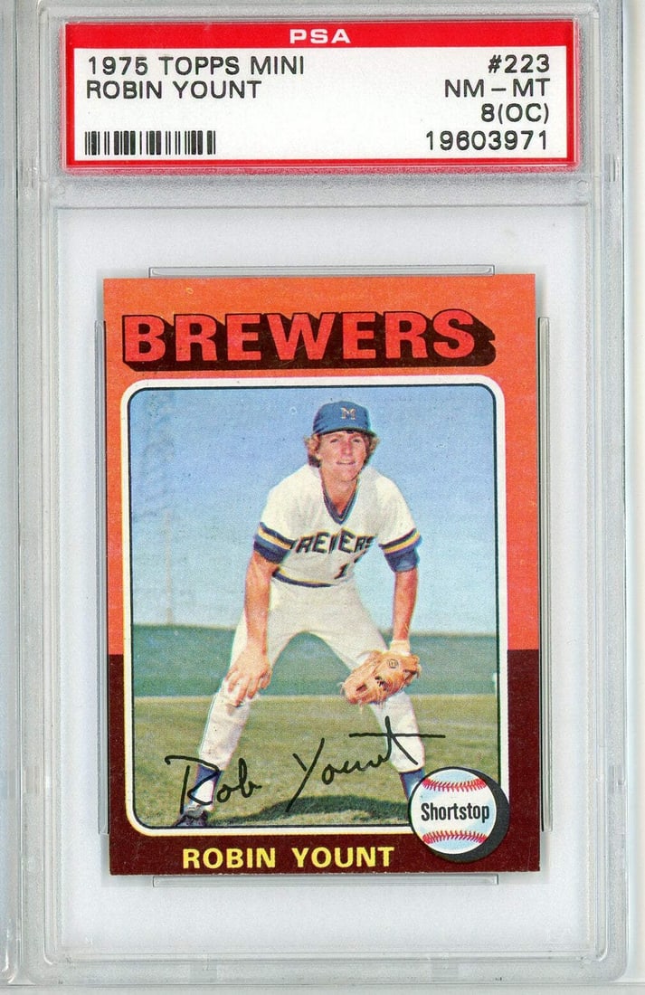 1975 Topps Mini Robin Yount #223 Rookie Baseball Card PSA 8: 1975 Topps Mini Robin Yount #223 Rookie Baseball Card PSA 8 This is a graded 1975 Topps Mini Robin Yount #223 Rookie RC Baseball Card, showcasing the talented athlete Robin Yount, who played for the M