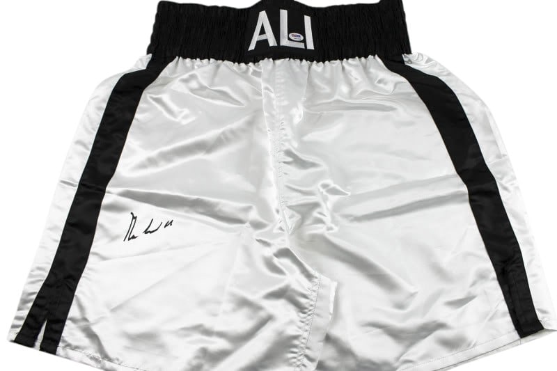 Muhammad Ali Signed Boxing Trunks PSA/DNA Certified Autograph: Muhammad Ali Signed Boxing Trunks PSA/DNA Certified Autograph This is an authentic pair of boxing trunks signed by the legendary Muhammad Ali, a key figure in the sport of boxing. The trunks come with