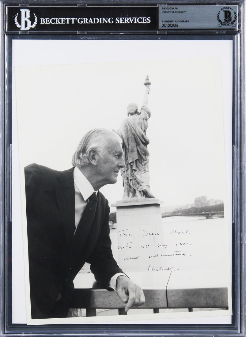 Hubert De Givenchy Signed 8x10 Photo with Inscription Beckett Authenticated: Hubert De Givenchy Signed 8x10 Photo with Inscription Beckett Authenticated This is an authentic 8x10 black and white photo personally signed by renowned designer Hubert De Givenchy. The photo feature