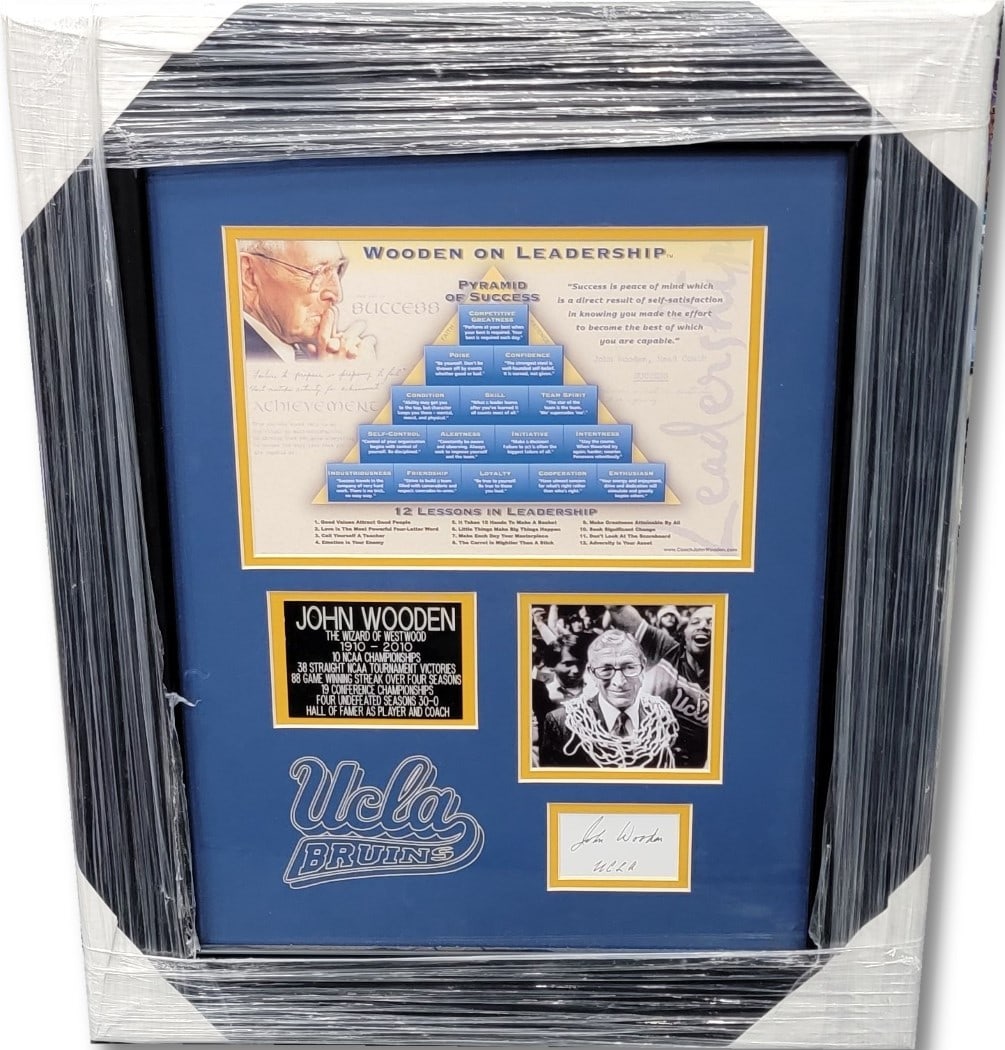 John Wooden Autographed Cut Pyramid of Success Framed 19x23 GAI Certified: John Wooden Autographed Cut Pyramid of Success Framed 19x23 GAI Certified This framed cut features the renowned John Wooden's signature, celebrated as one of the greatest basketball coaches in history