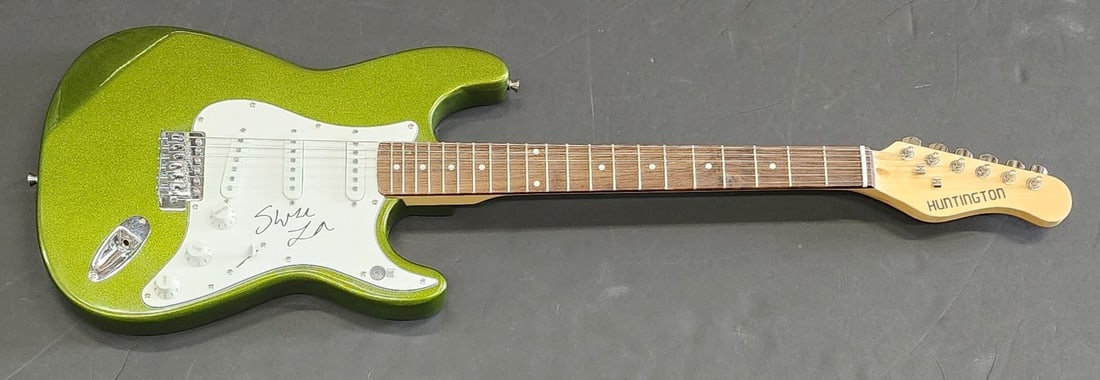 Swae Lee Hand Signed Electric Green Guitar Beckett Authenticated: Swae Lee Hand Signed Electric Green Guitar Beckett Authenticated This electric green guitar is a unique piece autographed by Swae Lee, featuring authentication from Beckett Autograph Authentication. T