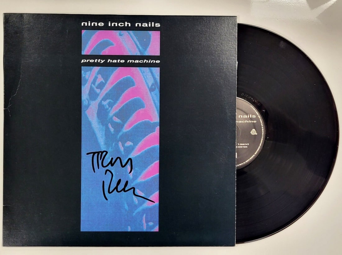 Trent Reznor Signed Pretty Hate Machine Nine Inch Nails Beckett Authenticated: Trent Reznor Signed Pretty Hate Machine Nine Inch Nails Beckett Authenticated This item features a signed copy of "Pretty Hate Machine" by Trent Reznor, the iconic frontman of Nine Inch Nails. The aut