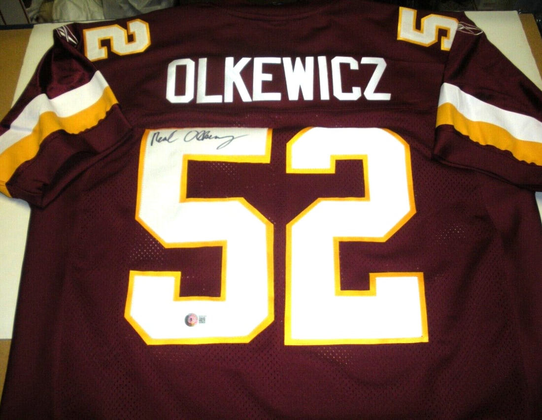 Neal Olkewicz Signed Official Reebok Redskins Jersey with COA: Neal Olkewicz Signed Official Reebok Redskins Jersey with COA This official licensed Reebok jersey features the signature of Neal Olkewicz, a notable player in the NFL. The jersey is an authentic piec
