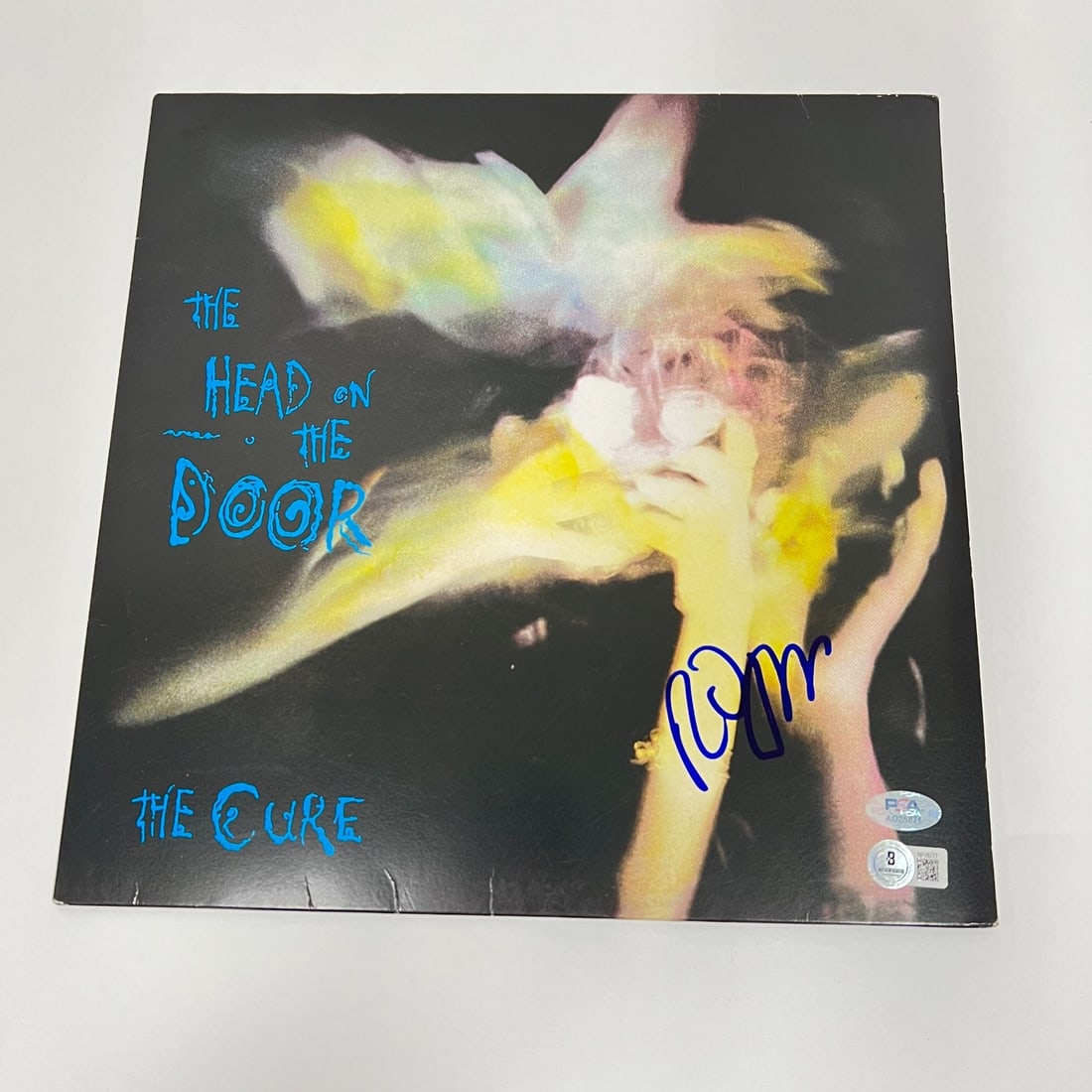 Robert Smith Signed The Head in the Door Vinyl PSA/DNA Authentication: Robert Smith Signed The Head in the Door Vinyl PSA/DNA Authentication This is an original vinyl record of "The Head on the Door" by The Cure, signed by Robert Smith. The autograph has been authenticat