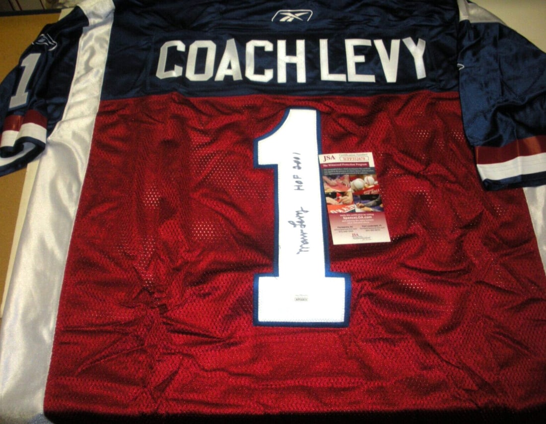 Marv Levy Signed Reebok Montreal Alouettes Jersey with JSA COA: Marv Levy Signed Reebok Montreal Alouettes Jersey with JSA COA This is an officially licensed Reebok jersey, signed by Marv Levy, a notable figure associated with the Montreal Alouettes. The jersey is