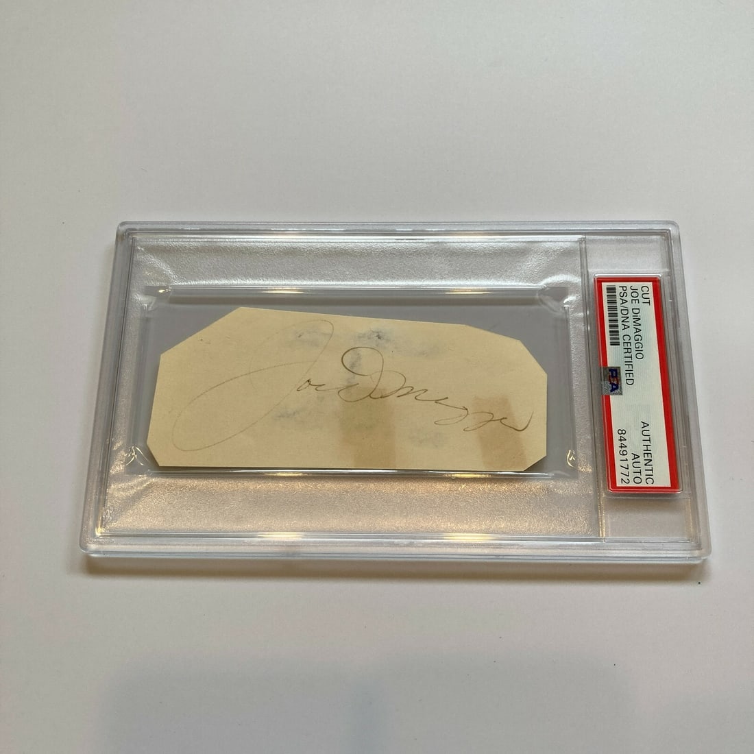 Joe Dimaggio 1950s PSA DNA Signed Cut Signature Postcard: Joe Dimaggio 1950s PSA DNA Signed Cut Signature Postcard Collect a piece of baseball history with this large cut signature of Joe DiMaggio from the 1950s. Authenticated by the Professional Sports Auth