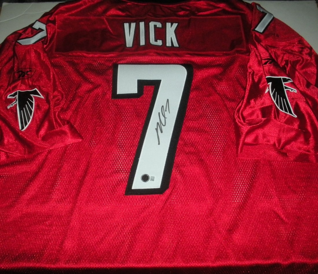 Michael Vick Signed Atlanta Falcons Reebok Jersey with COA: Michael Vick Signed Atlanta Falcons Reebok Jersey with COA This official licensed Reebok jersey features the signature of Michael Vick, a standout player for the Atlanta Falcons. Designed for football