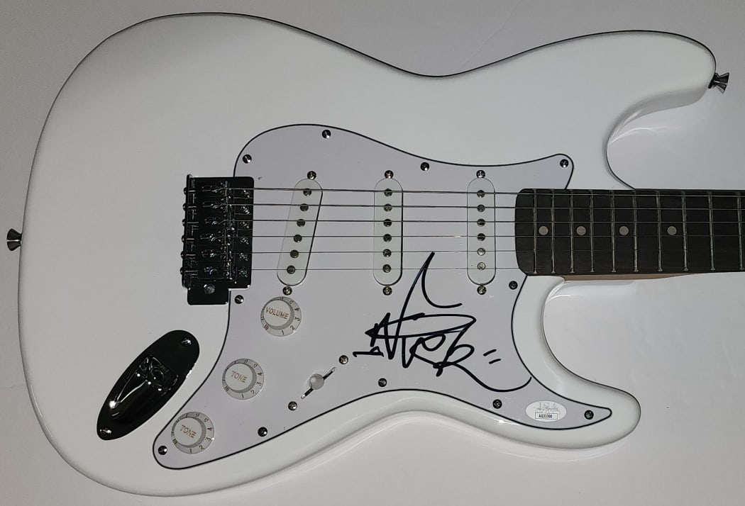 Vanilla Ice Autographed Guitar with JSA Authentication Hip Hop Collectible: Vanilla Ice Autographed Guitar with JSA Authentication Hip Hop Collectible This is an authentic autographed guitar by the iconic rapper Vanilla Ice, known for his hit song "Ice Ice Baby." The guitar c