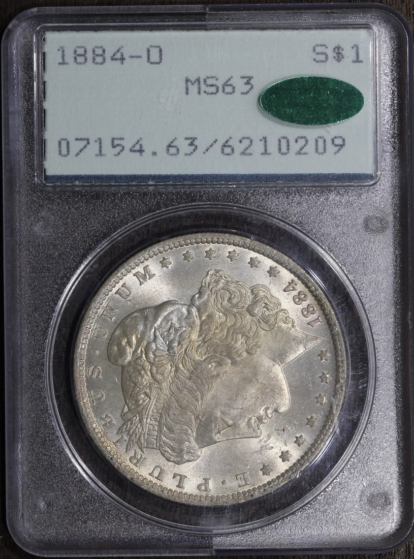 1884-O Morgan Silver Dollar MS63 CAC PCGS Rattler Lightly Toned: 1884-O Morgan Silver Dollar MS63 CAC PCGS Rattler Lightly Toned This 1884-O Morgan Silver Dollar is a stunning piece from the New Orleans Mint, graded MS63 by PCGS and featuring CAC certification. The