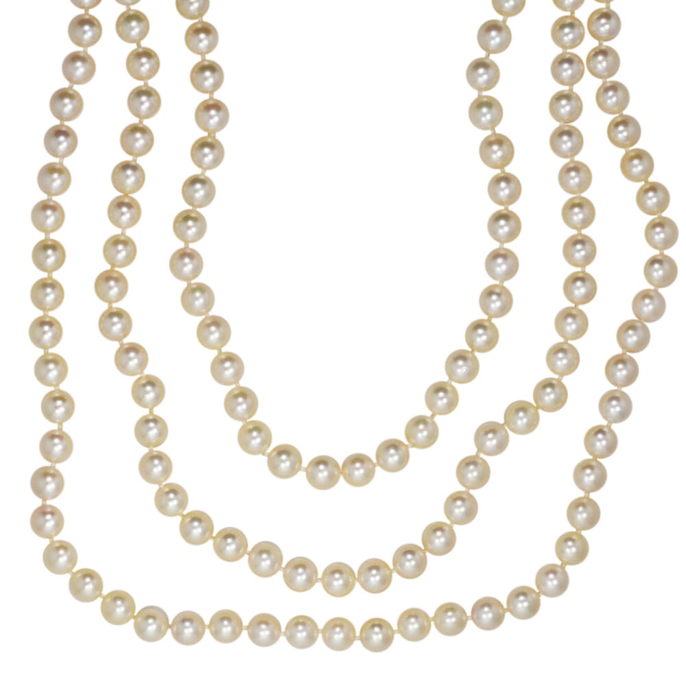 Elegant Triple Strand 14k Yellow Gold Pearl Necklace: Elegant Triple Strand 14k Yellow Gold Pearl Necklace This exquisite triple strand pearl necklace features high-quality saltwater cultured pearls, ranging from 6.5mm to 7mm in diameter. The pearls show