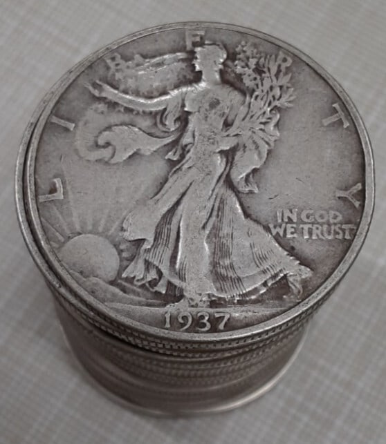 1937 Walking Liberty Half Dollar Roll 20 Circulated Silver Coins: 1937 Walking Liberty Half Dollar Roll 20 Circulated Silver Coins This roll contains 20 circulated 1937 Walking Liberty Half Dollars, each made of 90% silver. These coins feature the iconic Liberty Wal