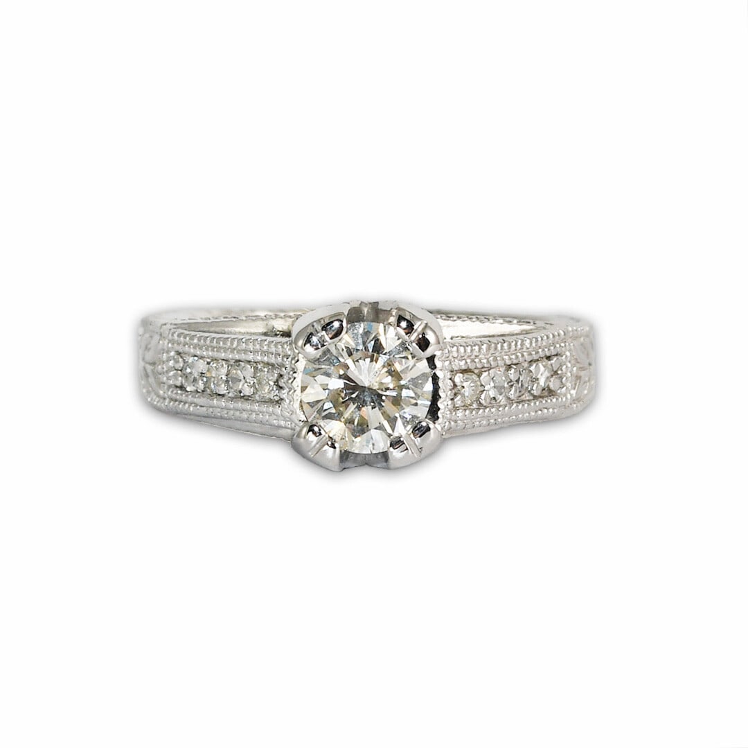 14K White Gold 0.70 ct Diamond Engagement Ring Brilliant Cut: 14K White Gold 0.70 ct Diamond Engagement Ring Brilliant Cut This exquisite 14K white gold engagement ring features a stunning natural diamond at its center, weighing 0.70 carats and showcasing a bril