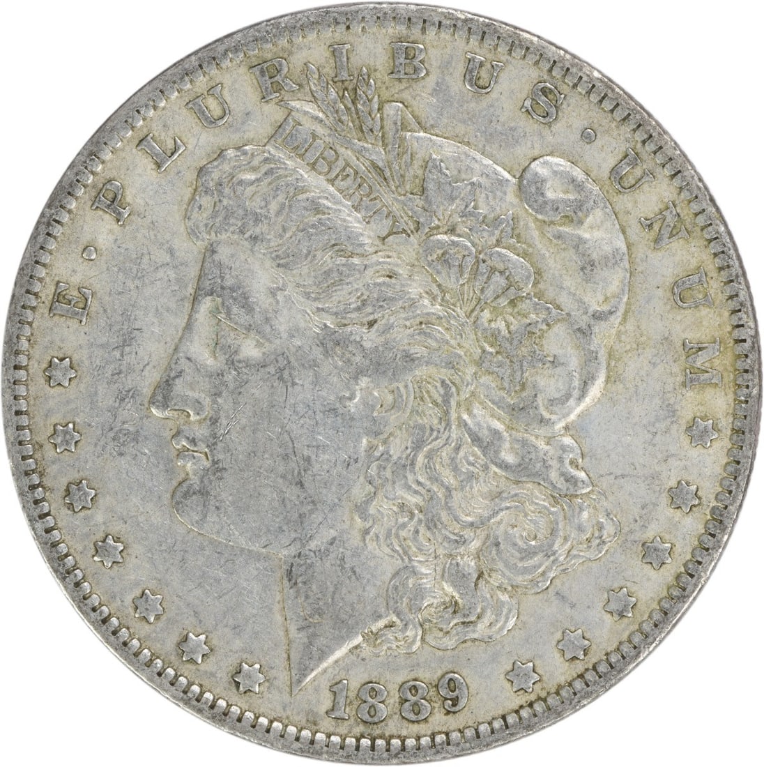 1889-O Morgan Silver Dollar EF Uncertified 90% Silver Coin: 1889-O Morgan Silver Dollar EF Uncertified 90% Silver Coin This 1889-O Morgan Silver Dollar is a stunning piece of numismatic history, featuring a design by George T. Morgan. The coin, minted in New O
