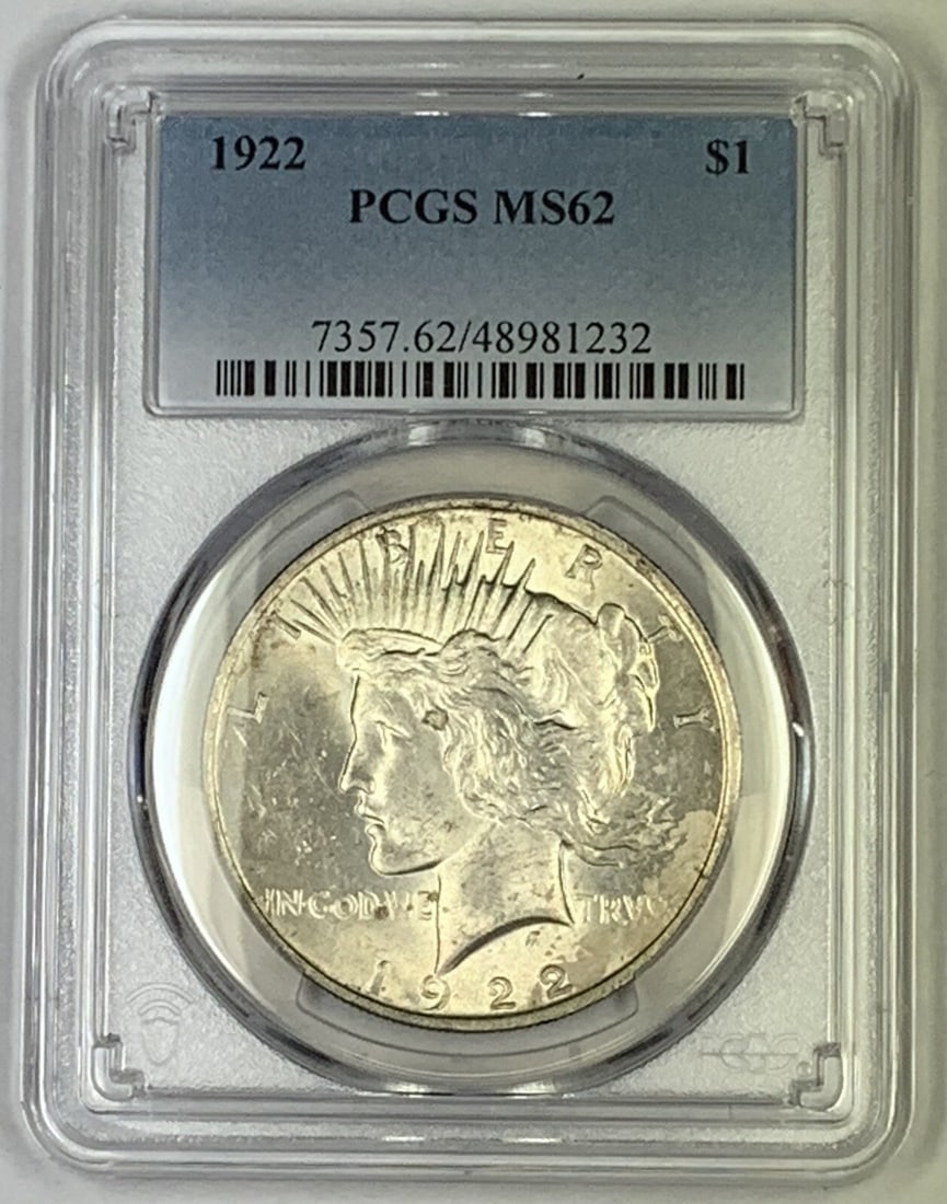 1922 Peace Silver Dollar Coin PCGS MS 62 Uncirculated: 1922 Peace Silver Dollar Coin PCGS MS 62 Uncirculated This 1922 Peace Silver Dollar showcases a stunning design and is certified by PCGS with a grade of MS 62. The coin features the iconic Peace desig
