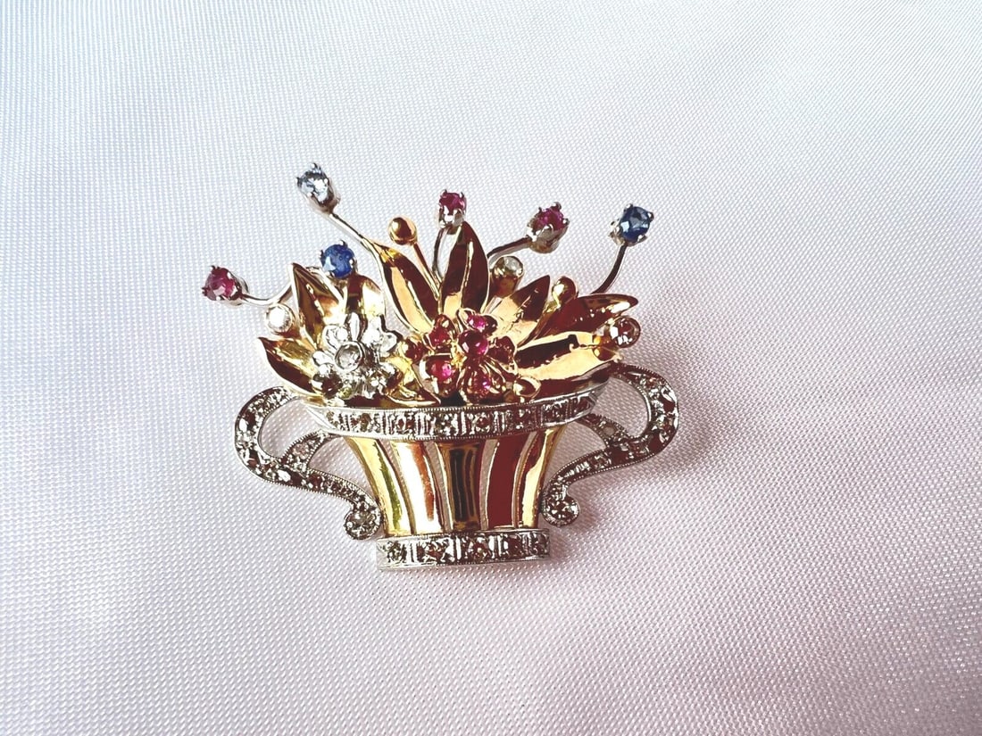 French 18K Gold Flower Basket Brooch with Diamonds Rubies Sapphires: French 18K Gold Flower Basket Brooch with Diamonds Rubies Sapphires This exquisite brooch showcases a stunning French basket of flowers, crafted from 18K gold and adorned with diamonds, rubies, and sa