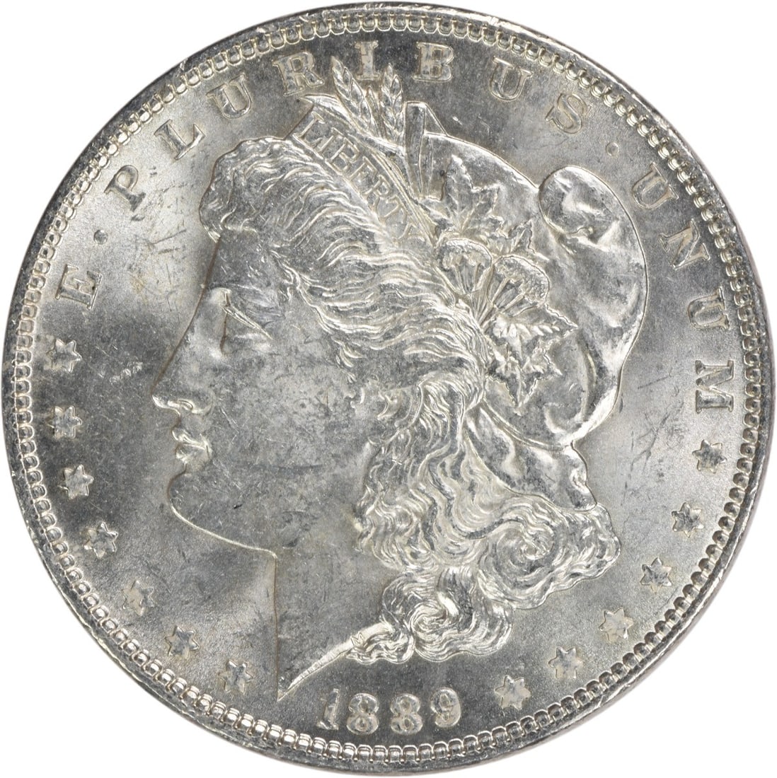 1889 Morgan Silver Dollar Choice BU Uncertified Silver Coin: 1889 Morgan Silver Dollar Choice BU Uncertified Silver Coin This 1889 Morgan Silver Dollar is a stunning piece, classified as Choice BU (Brilliant Uncirculated). It features a silver composition and w