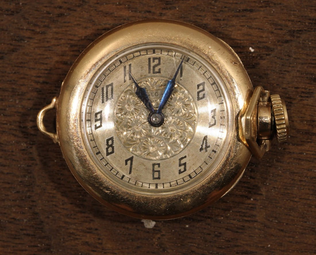 Vintage Bulova 10K Gold Filled Pocket Watch 1982-1983 Mechanical: Vintage Bulova 10K Gold Filled Pocket Watch 1982-1983 Mechanical This exquisite Bulova vintage pocket watch is a stunning example of craftsmanship from 1982-1983. The watch features a gold bezel and a