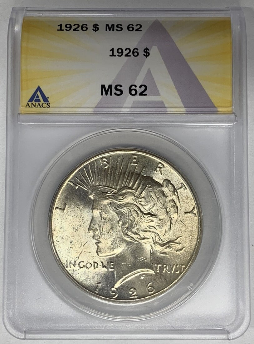 1926 Peace Silver Dollar Coin ANACS MS 62 Silver Composition: 1926 Peace Silver Dollar Coin ANACS MS 62 Silver Composition This 1926 Peace Silver Dollar Coin is a remarkable piece, showcasing the iconic design that symbolizes peace. With a denomination of $1, th