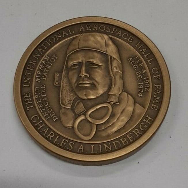 Lindbergh Trans-Atlantic Flight Golden Jubilee Bronze Medal by Medallic Art Co: Lindbergh Trans-Atlantic Flight Golden Jubilee Bronze Medal by Medallic Art Co Celebrate the historic Lindbergh Trans-Atlantic Flight with this Golden Jubilee Bronze Medal by Medallic Art Co. This med