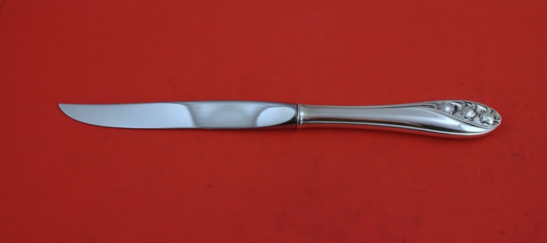 Gorham Lily of the Valley Sterling Silver Steak Knife 8 7/8": Gorham Lily of the Valley Sterling Silver Steak Knife 8 7/8" Elevate your dining experience with this exquisite steak knife from the renowned Gorham brand, featuring the elegant Lily of the Valley pat