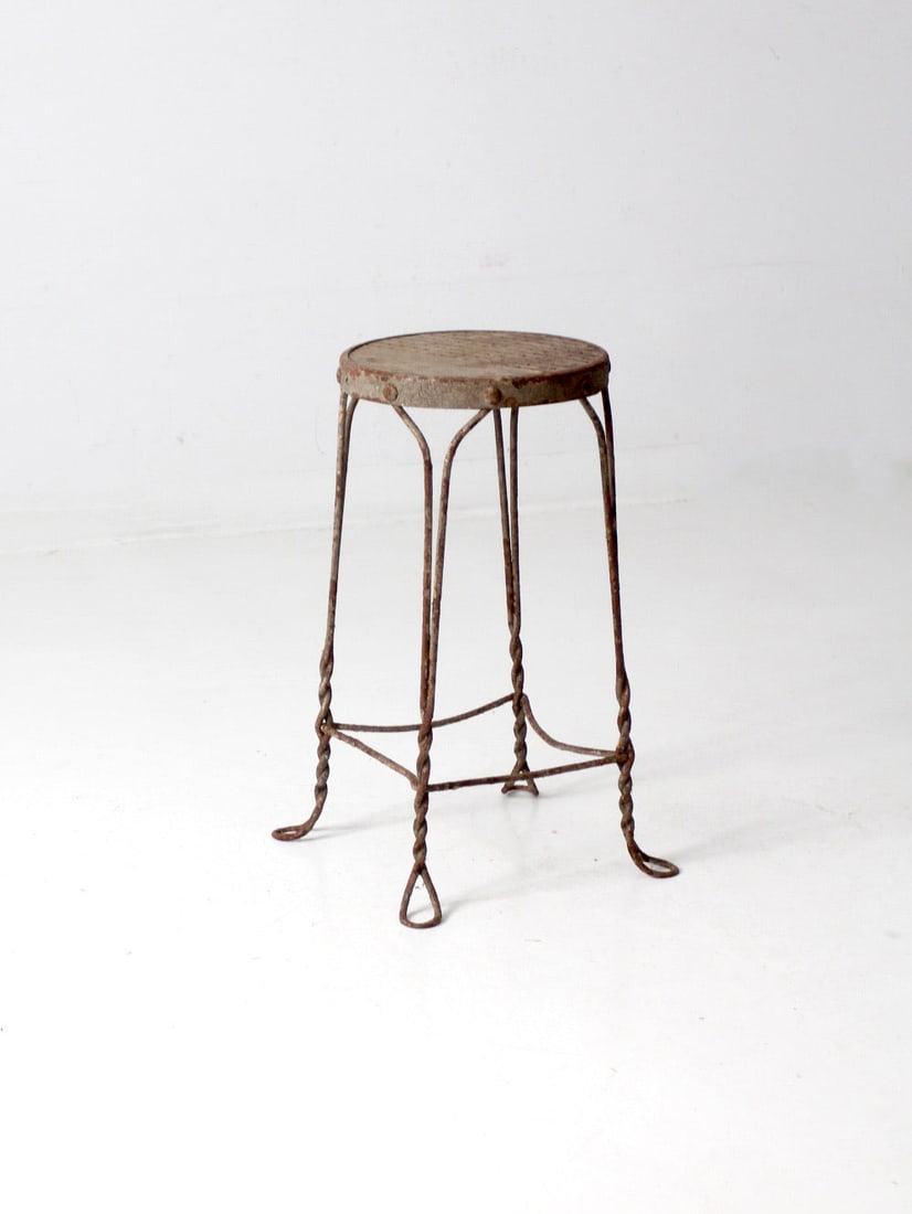 Art Nouveau Antique Ice Cream Parlor Stool 25" Height: Art Nouveau Antique Ice Cream Parlor Stool 25" Height Discover the charm of this antique ice cream parlor stool, showcasing a classic art nouveau design. The stool features a twisted metal frame and a