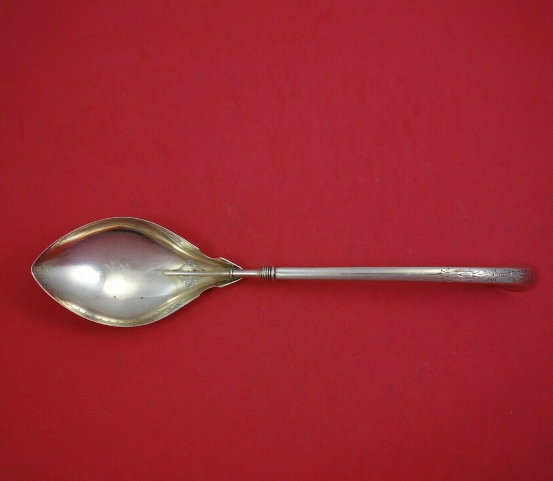 Gorham Angelo Sterling Silver Serving Spoon 10 1/4 inch Light Gold Wash: Gorham Angelo Sterling Silver Serving Spoon 10 1/4 inch Light Gold Wash This exquisite serving spoon is part of the Angelo pattern by Gorham, crafted from high-quality sterling silver. Featuring a hol