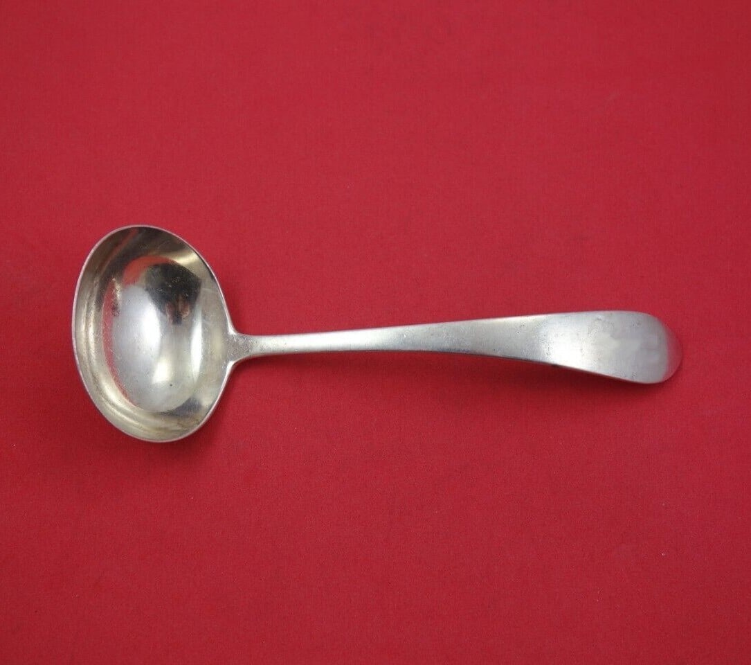 Gorham Puritan Sterling Silver Gravy Ladle 5 3/8 Inch Serving Piece: Gorham Puritan Sterling Silver Gravy Ladle 5 3/8 Inch Serving Piece This exquisite gravy ladle is crafted from high-quality sterling silver by Gorham, showcasing the elegant Puritan pattern. Measuring