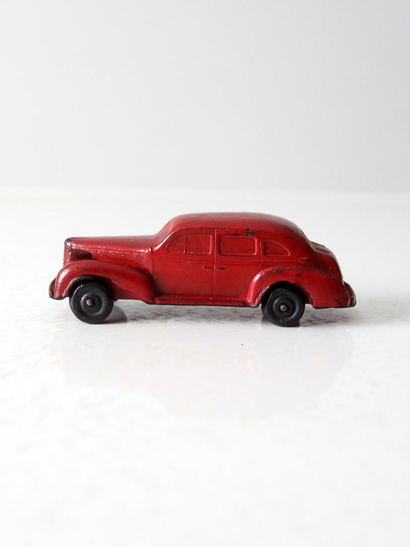 Vintage 1930s Auburn Rubber Toy Car Red Black Wheels: Vintage 1930s Auburn Rubber Toy Car Red Black Wheels Discover a charming piece of nostalgia with this late 1930s Auburn Rubber Co. toy car, reminiscent of a classic 1937 Oldsmobile. This collectible t