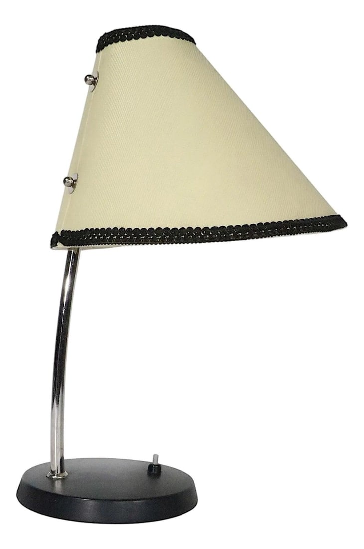 Vintage Chrome Desk Lamp with Black Base Made in Europe: Vintage Chrome Desk Lamp with Black Base Made in Europe This vintage desk reading bedside lamp, made in Europe, showcases a stylish bonnet form shade complemented by a bright chrome vertical tube. The