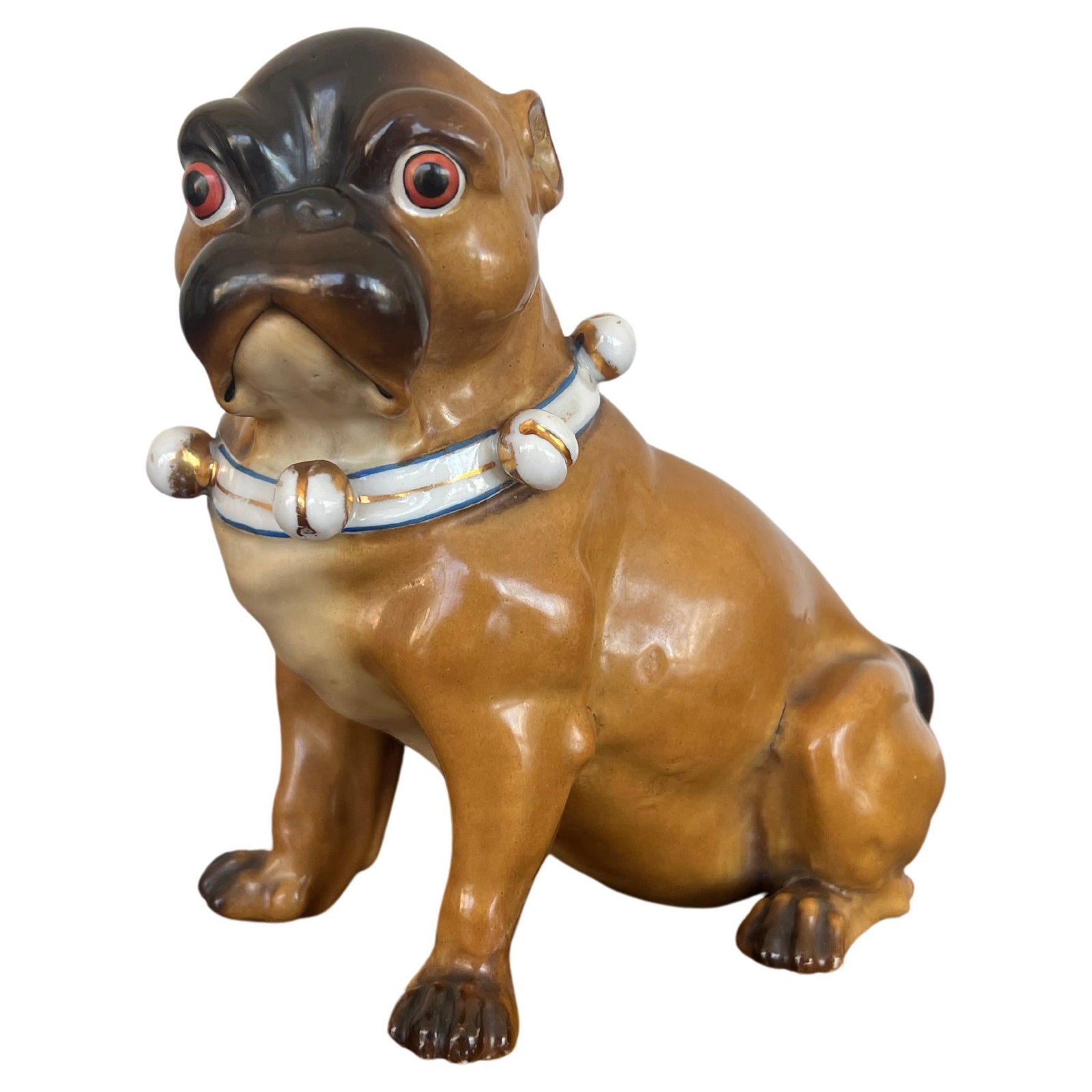 19th Century German Porcelain Seated Pug Dog Figure: 19th Century German Porcelain Seated Pug Dog Figure This exquisite antique German porcelain figure features a charming seated pug, showcasing the artistry of the late 19th century. Crafted around 1880