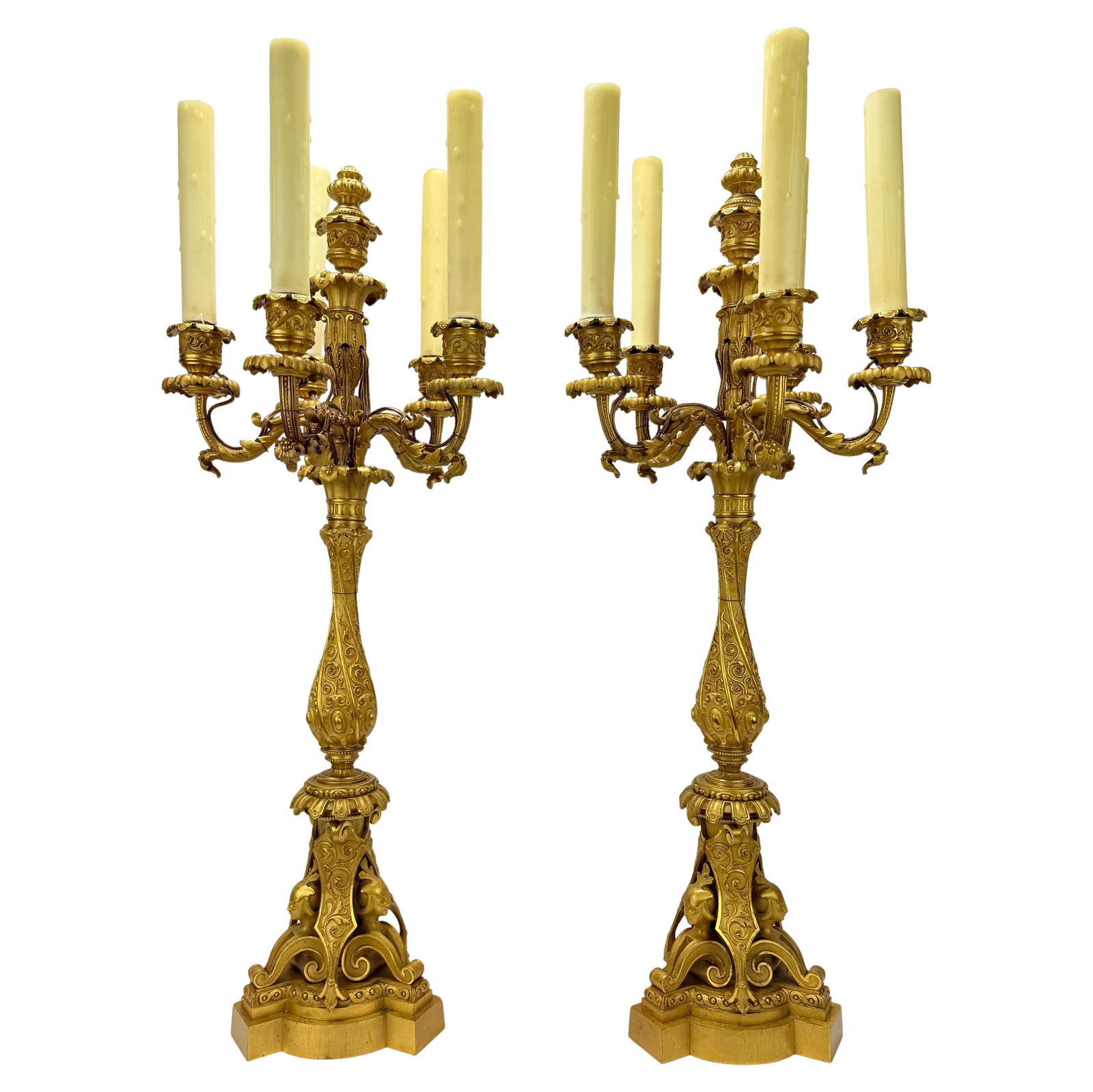 Monumental 19th Century French Gilt Bronze Egyptian Revival Candelabras Set of 2: Monumental 19th Century French Gilt Bronze Egyptian Revival Candelabras Set of 2 This exceptional pair of monumental 19th Century French gilt bronze candelabras embodies the grandeur of the Egyptian R