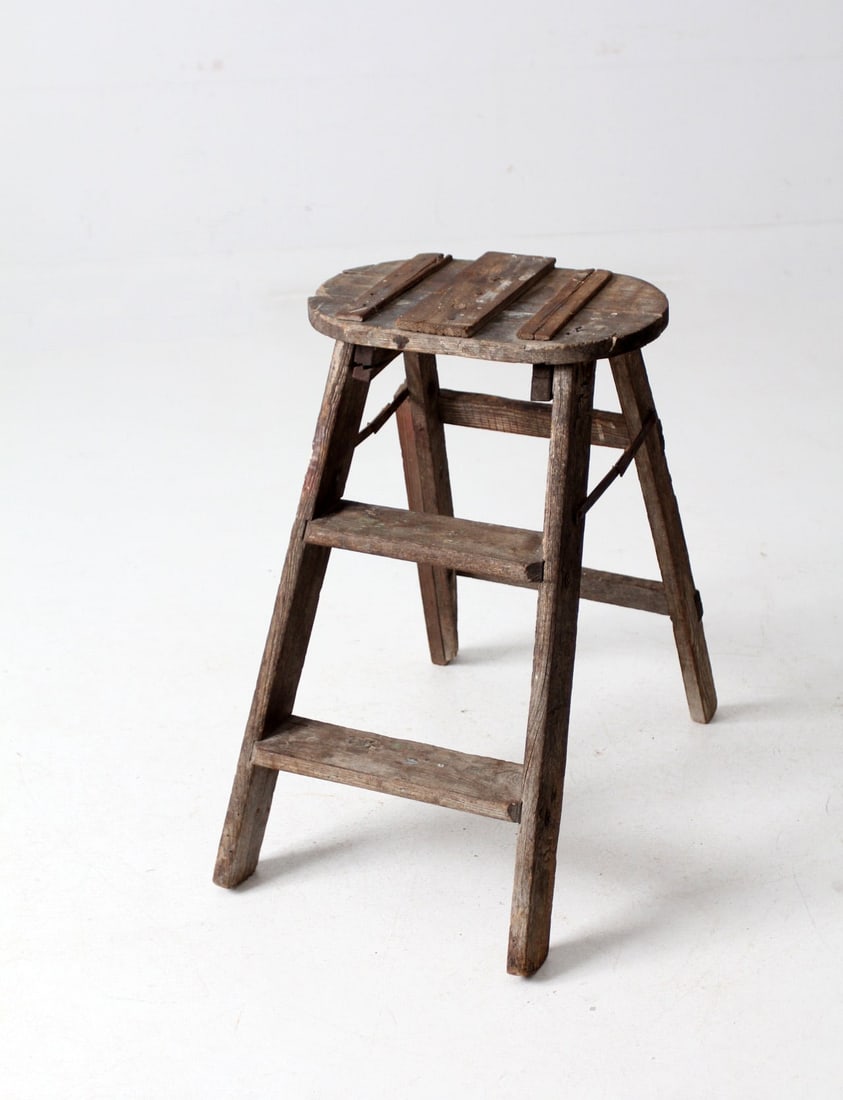 Charming Vintage Rustic Folding Step Ladder 23 inch: Charming Vintage Rustic Folding Step Ladder 23 inch This vintage folding step ladder features a charming rustic patina, showcasing its weathered wood and folk repairs that narrate a history of use. Id