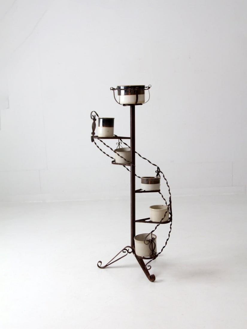 Charming Vintage Wrought Iron Spiral Plant Stand with Tiered Shelves: Charming Vintage Wrought Iron Spiral Plant Stand with Tiered Shelves Enhance your living space with this charming vintage wrought iron spiral plant stand, designed to showcase your plants in style. Th