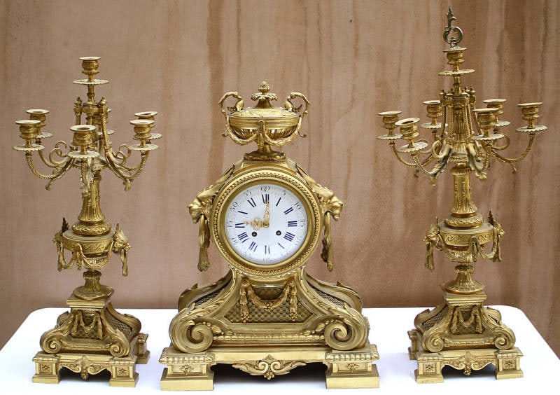 19th Century French Dore Bronze Clock Set with Candelabras: 19th Century French Dore Bronze Clock Set with Candelabras This exquisite 19th-century French three-piece dore bronze clock set is a stunning addition to any collection. Crafted between 1850 and 1899,