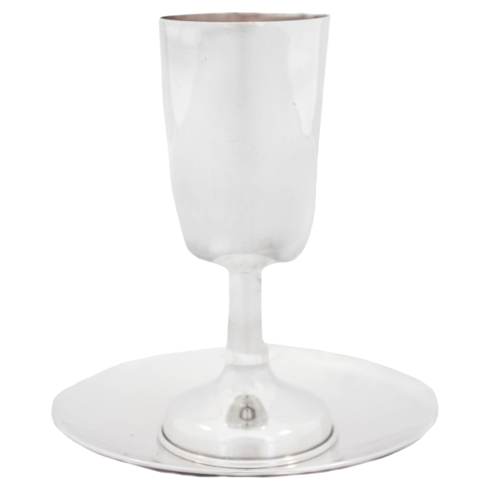 Modern Sterling Silver Kiddush Cup and Plate Set from Israel: Modern Sterling Silver Kiddush Cup and Plate Set from Israel This exquisite sterling silver Kiddush cup and plate set is a stunning addition to any home. Measuring 6.5 inches in height and 6 inches in