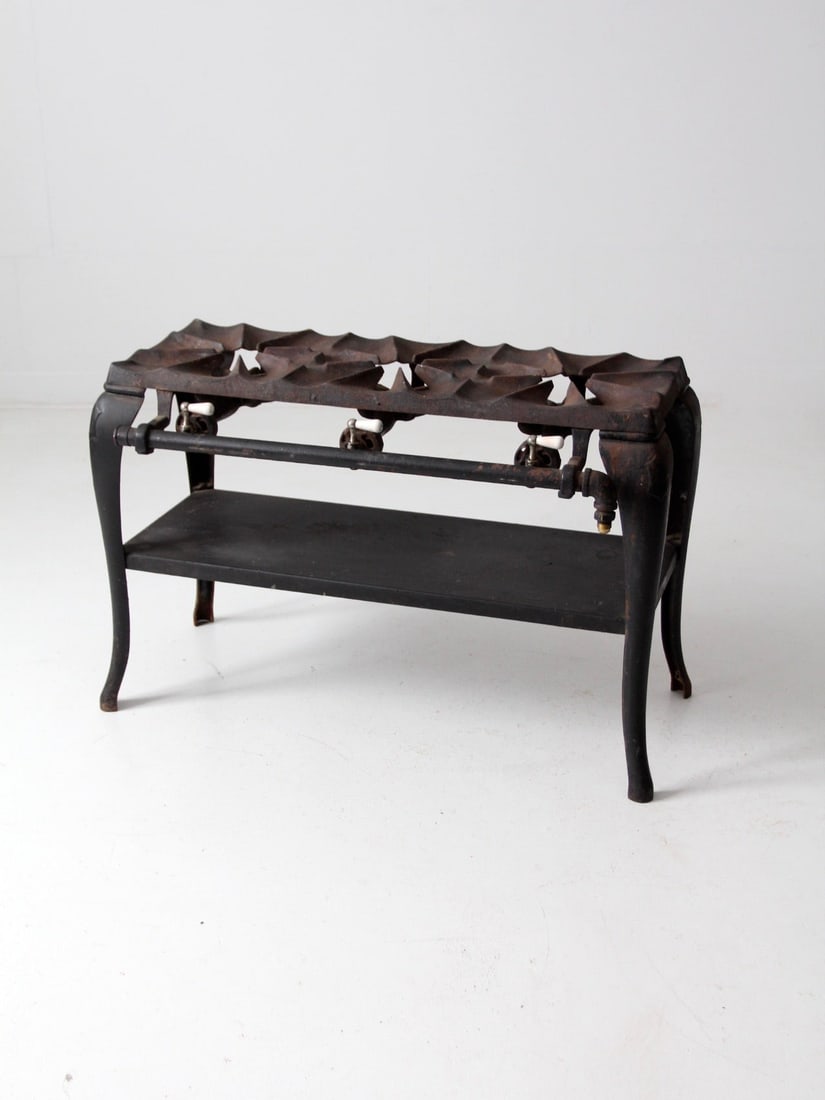 Vintage Antique Cast Iron Three Burner Stove with Ceramic Valves: Vintage Antique Cast Iron Three Burner Stove with Ceramic Valves Discover a charming piece of history with this antique cast iron stove, perfect for collectors and vintage enthusiasts. This three-burn