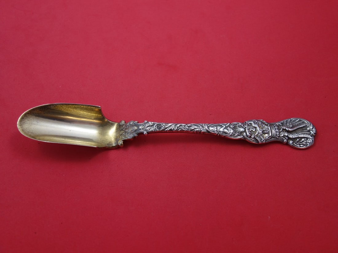 Durgin Heraldic Sterling Silver Cheese Scoop Goldwashed 8 1/4 Inches: Durgin Heraldic Sterling Silver Cheese Scoop Goldwashed 8 1/4 Inches This exquisite cheese scoop from the Heraldic pattern by Durgin combines functionality with stunning artistry. Crafted from sterlin