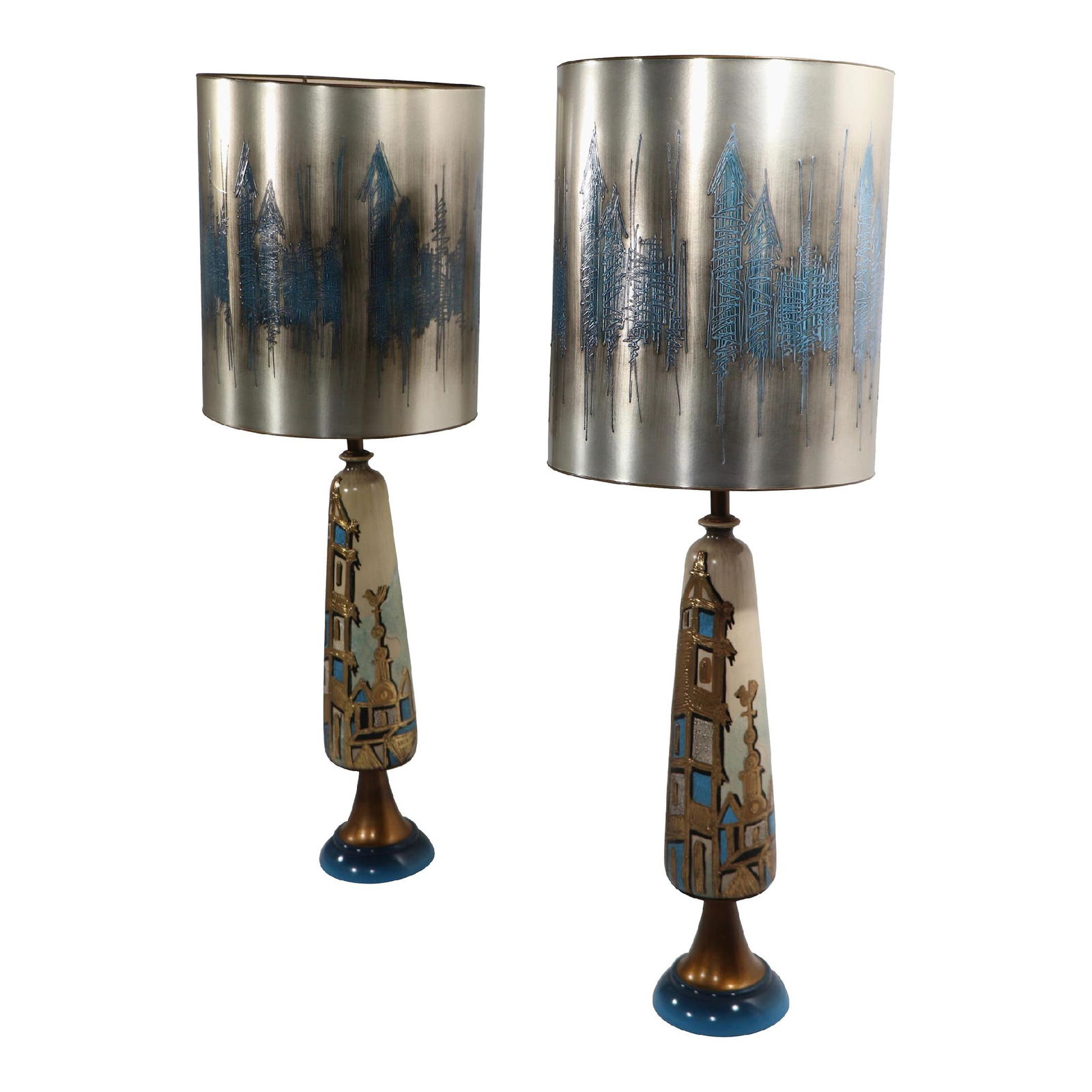 Mid-Century Brutalist Table Lamps Pair with Silver Shades: Mid-Century Brutalist Table Lamps Pair with Silver Shades This stunning pair of Brutalist table lamps showcases a mid-century design influenced by Hollywood Regency style. The ceramic bodies feature a