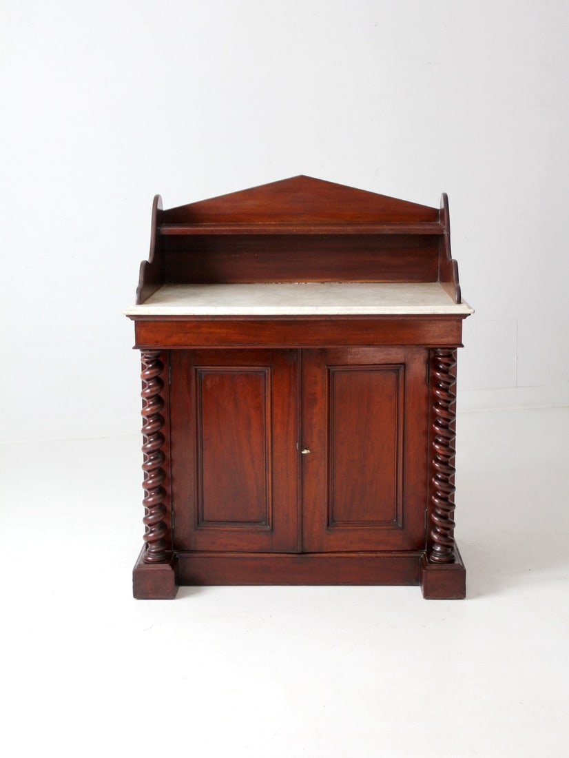 Victorian Antique Chiffonier Sideboard with Marble Top: Victorian Antique Chiffonier Sideboard with Marble Top Discover the charm of this elegant antique chiffonier, a stunning Victorian sideboard cabinet. It features a beautifully polished marble top and