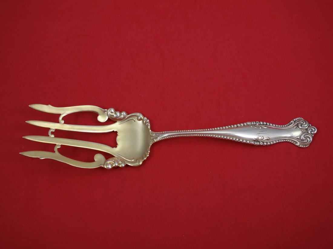 Towle Canterbury Sterling Silver Serving Fork Gold Washed 9 1/4": Towle Canterbury Sterling Silver Serving Fork Gold Washed 9 1/4" This exquisite buffet fork from the Canterbury pattern by Towle features a stunning gold wash finish and is crafted from high-quality s