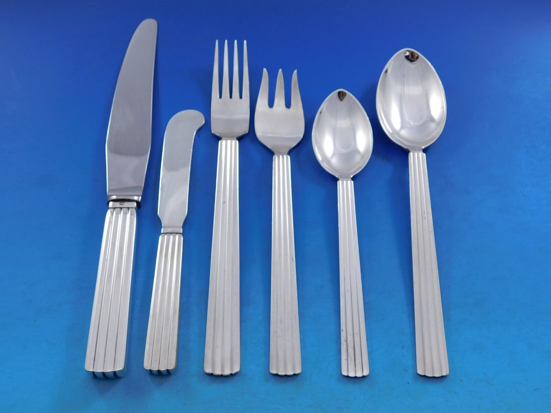 Georg Jensen Bernadotte Sterling Silver Flatware Set 36 pcs with Storage Chest: Georg Jensen Bernadotte Sterling Silver Flatware Set 36 pcs with Storage Chest Experience the elegance of dining with this exquisite Bernadotte flatware set by Georg Jensen. Crafted from sterling silv