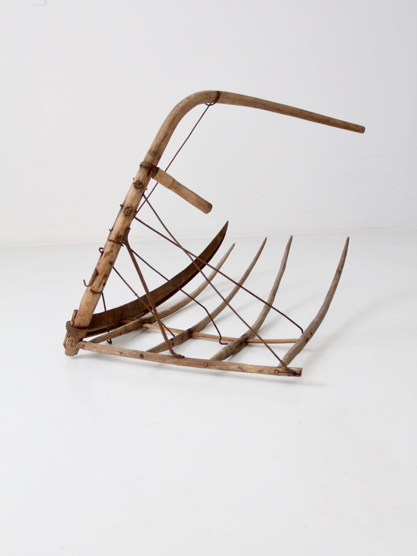 Antique Cradle Scythe Rustic Farm Tool 47 Inch: Antique Cradle Scythe Rustic Farm Tool 47 Inch This antique cradle scythe is a captivating primitive farm tool that represents the evolution of the classic scythe. It is designed for harvesting, allow