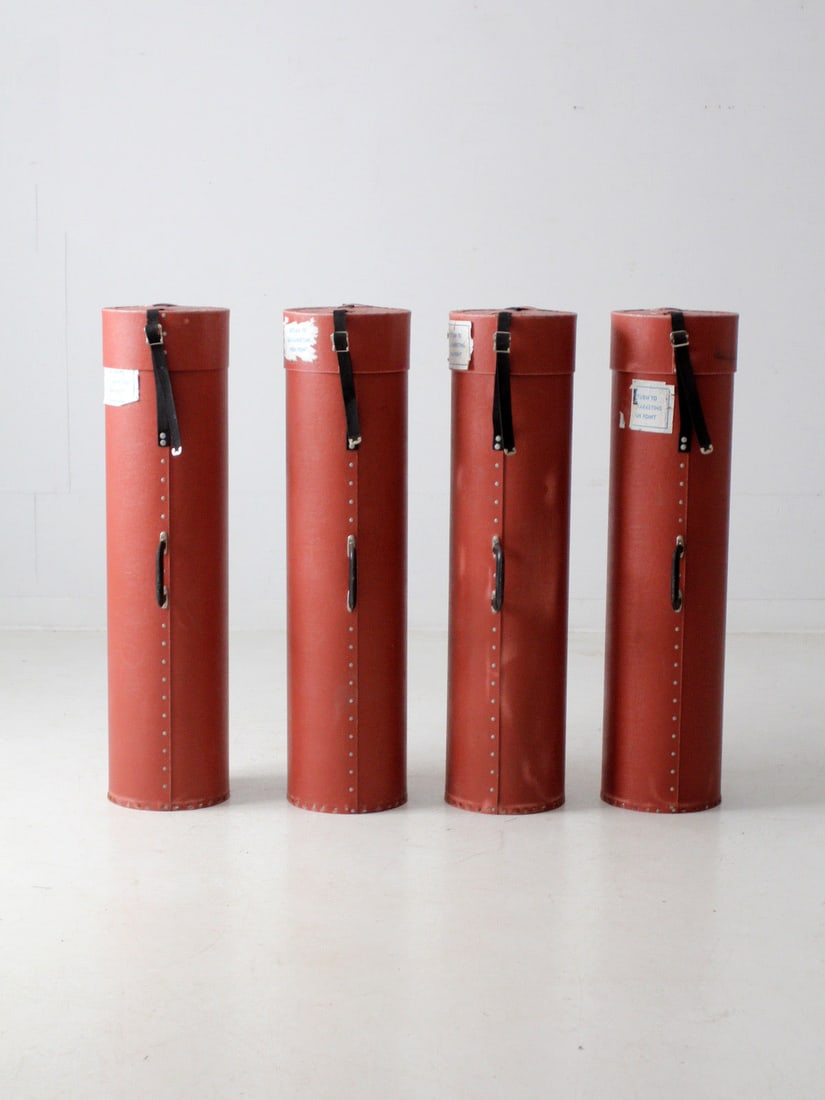 Set of 4 Vintage Industrial Fiberboard Transport Cases: Set of 4 Vintage Industrial Fiberboard Transport Cases This set features four vintage industrial transport cases crafted from reddish-brown fiberboard, showcasing riveted seams, belt-secured cap closu