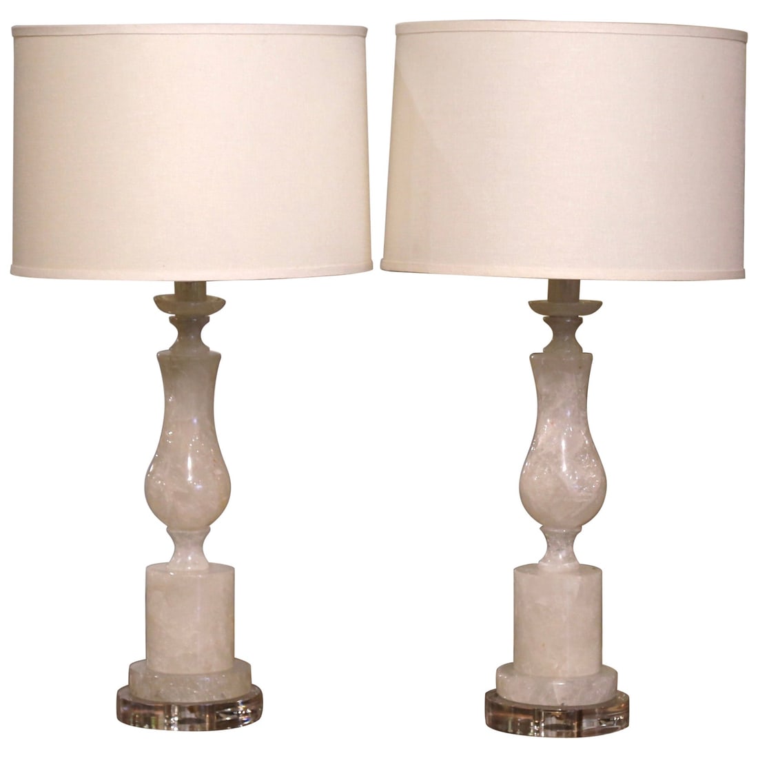 Set of 2 Hand-Carved Rock Crystal Table Lamps on Acrylic Bases: Set of 2 Hand-Carved Rock Crystal Table Lamps on Acrylic Bases Enhance your living space with this elegant pair of hand-carved rock crystal table lamps, expertly crafted in Brazil. Each lamp stands 24